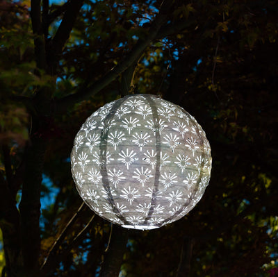 Soji Stella Deco Globe Tyvek Solar Lantern glowing at night