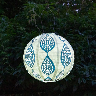 Soji Stella Printed Solar Lantern glowing in garden