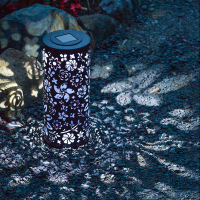 Bloom Metal Solar Lantern casting light patterns on ground