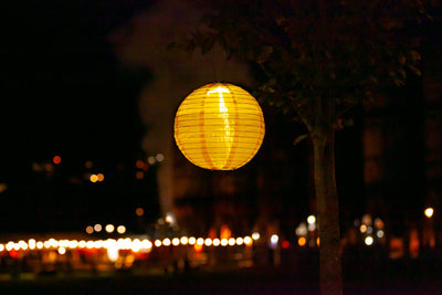 Canary Yellow Festival Solar lantern glowing at night