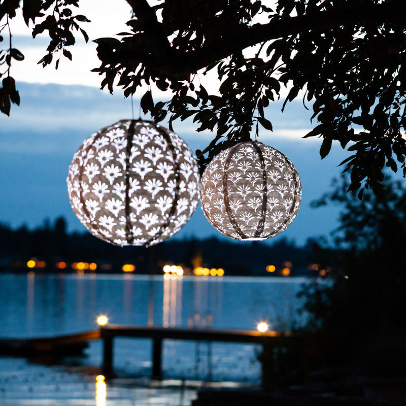 Soji Stella Deco Globe Tyvek Solar Lantern glowing at night