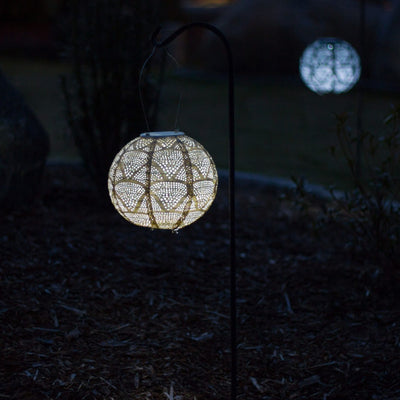 Soji Stella 8" Globe Tyvek Solar Lantern glowing at night