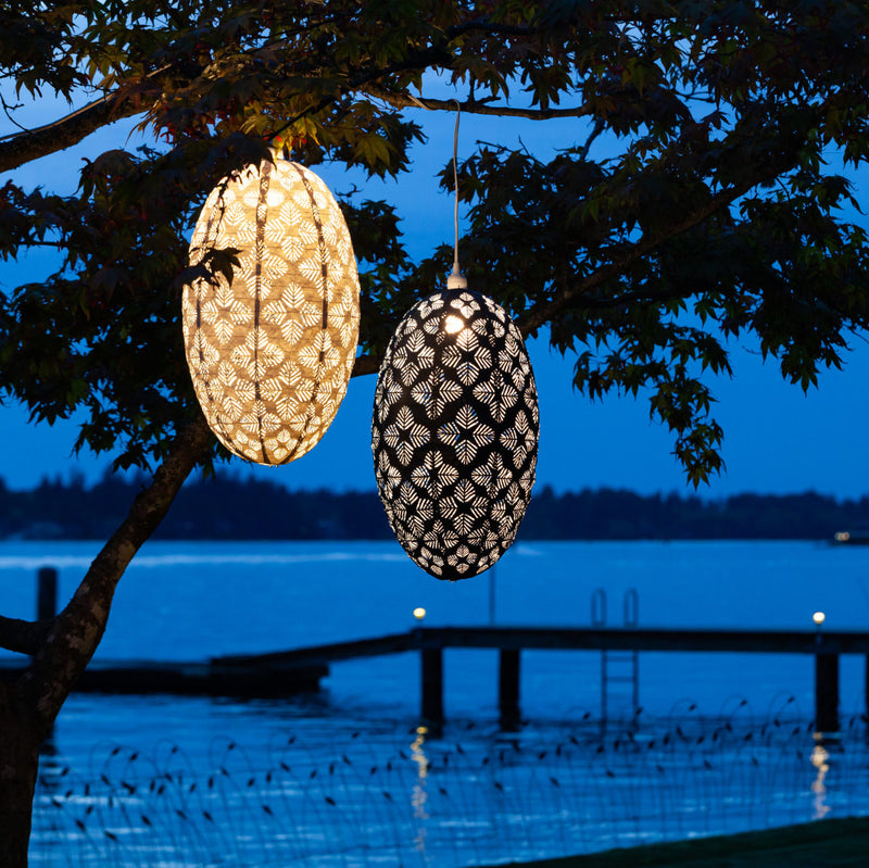 Soji Stella Nova Palm Pod Indoor Outdoor Tyvek Pendant Lamp in tree