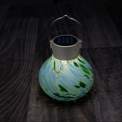 Tea Lantern Handlown Solar Glass on table