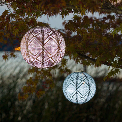 Soji Stella Tyvek Solar Lanterns glowing at night