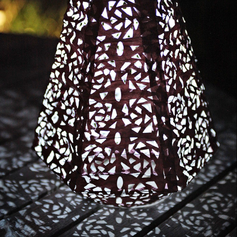Soji Stella Prism Tyvek Solar Lantern glowing at night